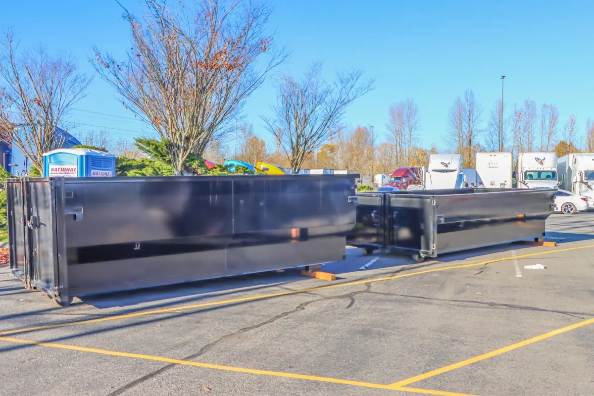 Professional dumpster rental service with roll-off container on residential driveway in Citrus Hills